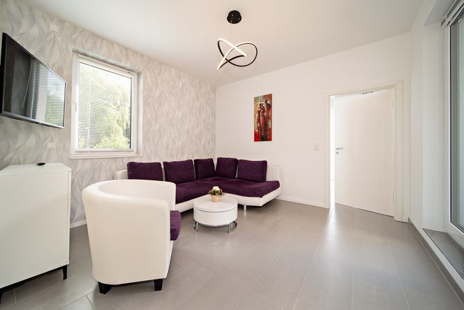 Ferienwohnung in B&ouml;rgerende - Appartement 2 - D&uuml;nenblick - 13qm Wohnzimmer mit Schlafcouch